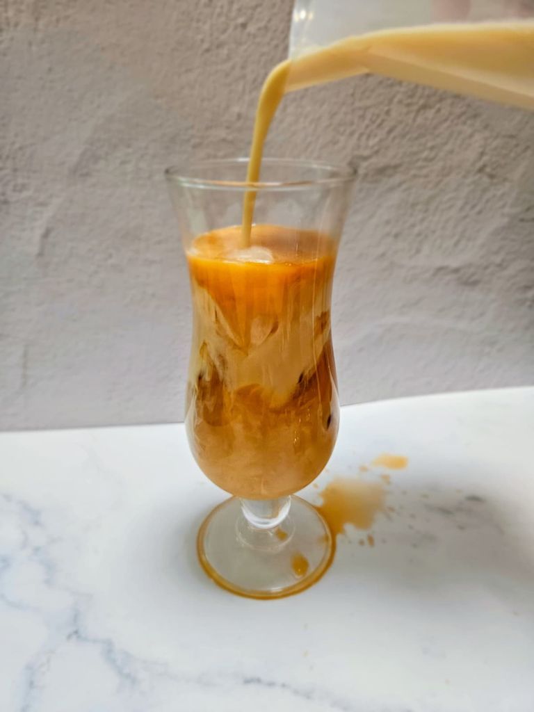i spilt my thai milk tea, now i have to clean this up before my mum scold me, how can i scroll phone image of a messy surface