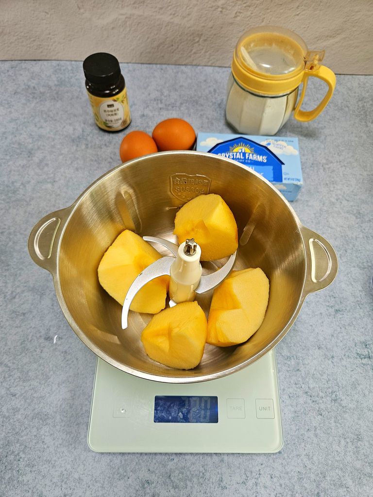 Chopped apples ready in the food processor Cutting apples
