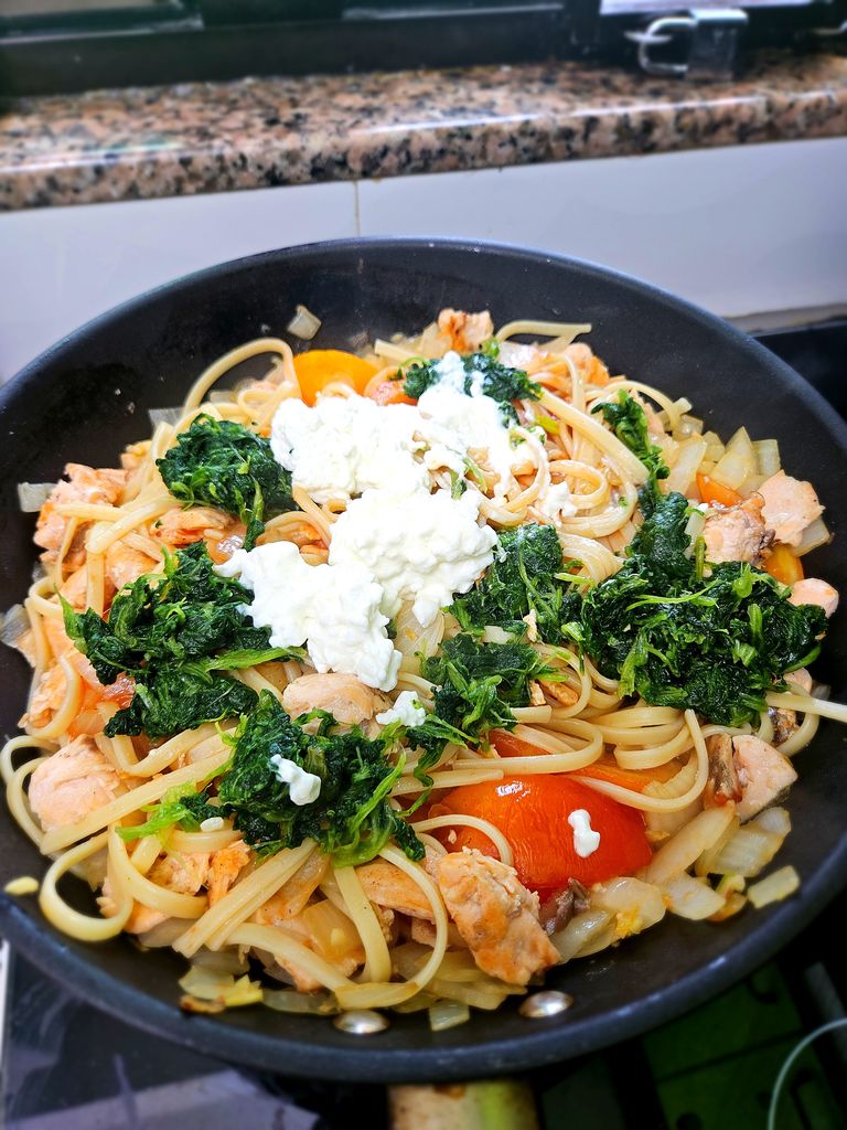 Adding cottage cheese to create the creamy sauce Adding cheese