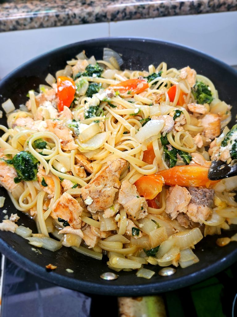 Final creamy salmon pasta with wilted spinach. I am cooking this for two servings when photographing (hence the fuller-looking pan), but the quantities in this recipe are scaled for one. Finish dish