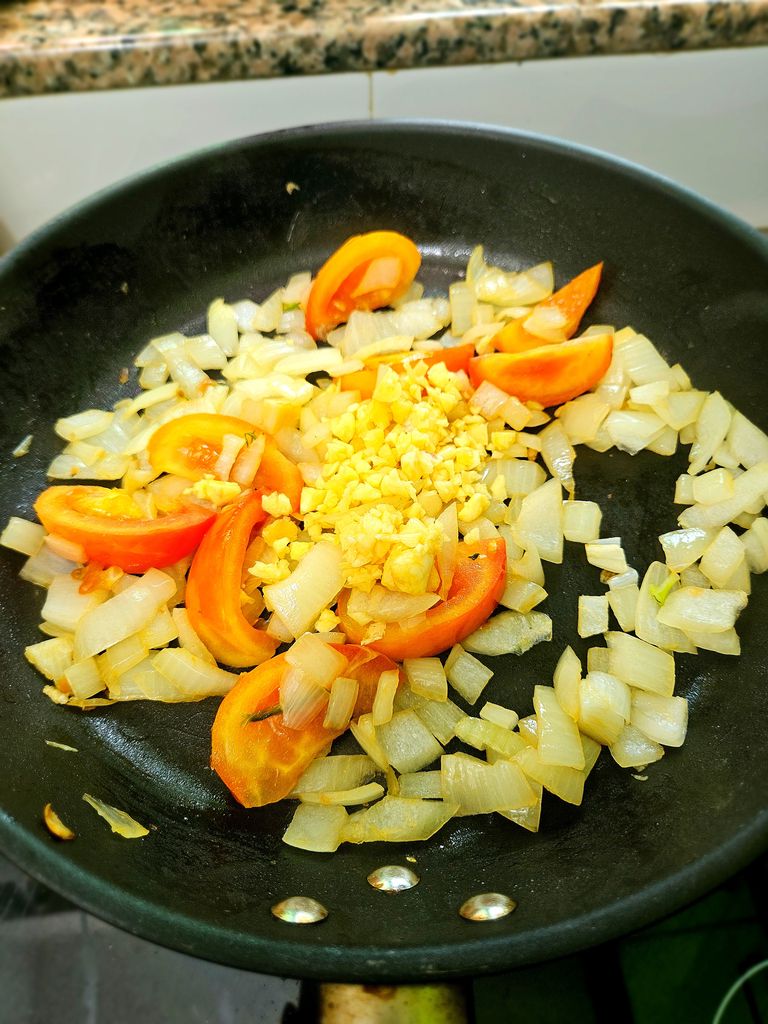 Cooking down the vegetables Sauce building