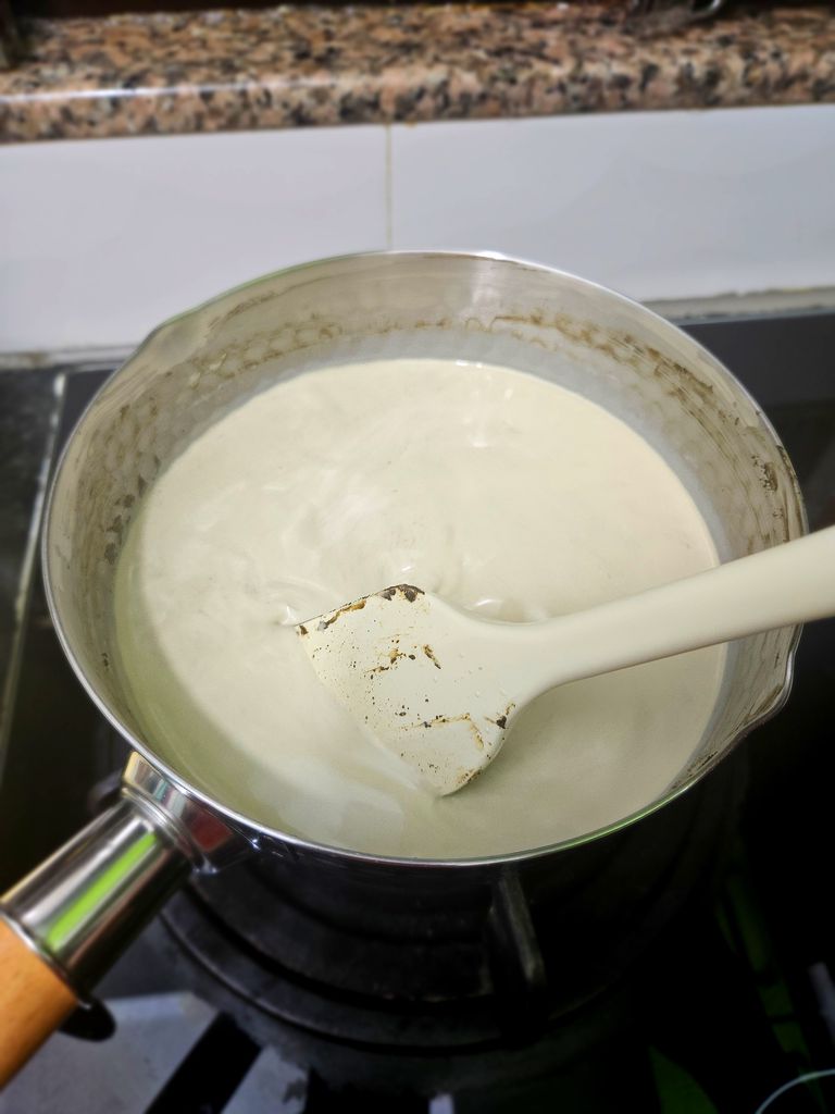 Whisking hojicha powder into the warm dairy mixture Mix in hojicha powder