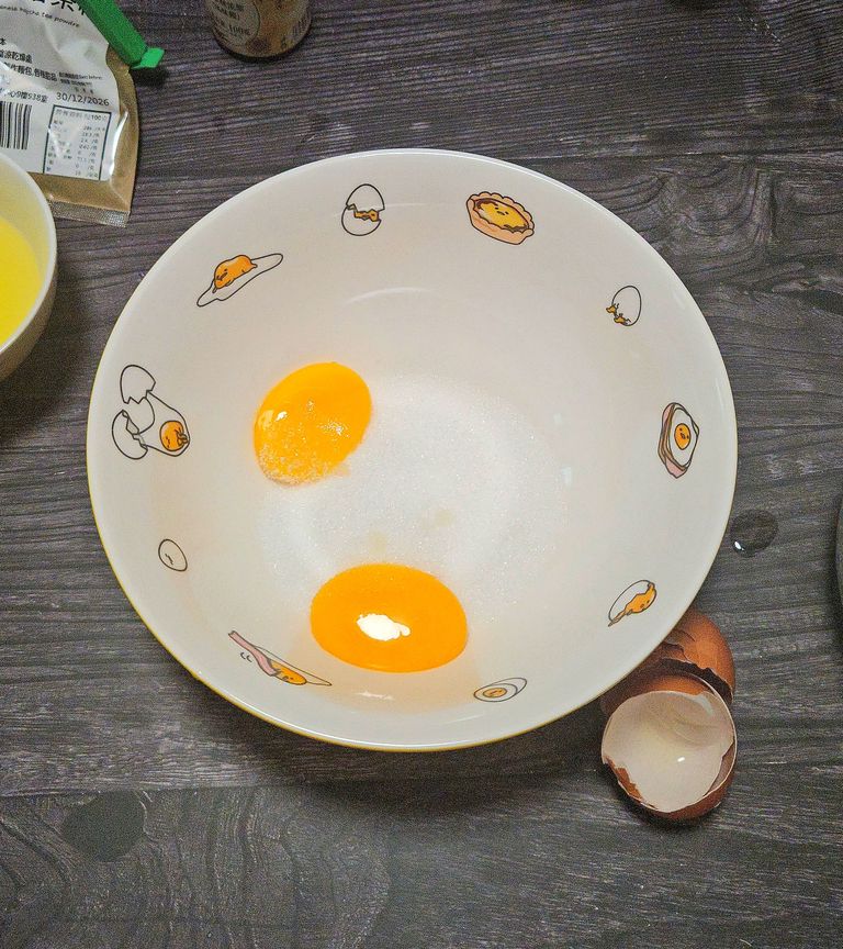 Egg yolks and sugar before whisking Sugar and egg yolk