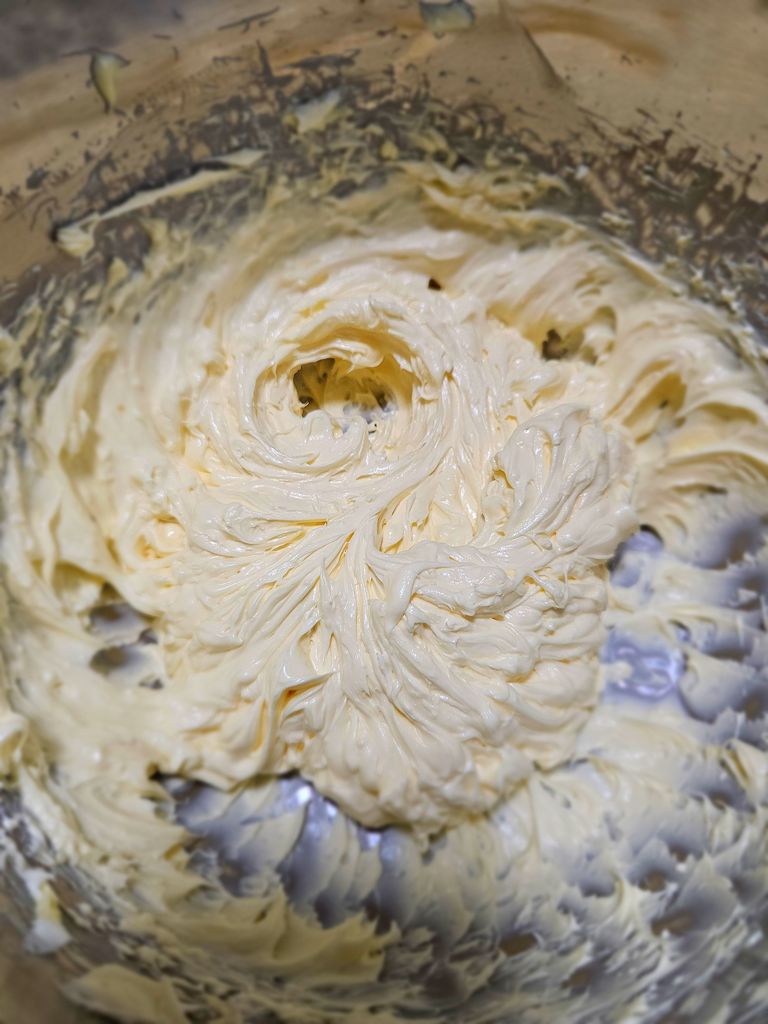 Since I am lazy, I am beating butter and cream cheese together instead of one by one. Beating butter
