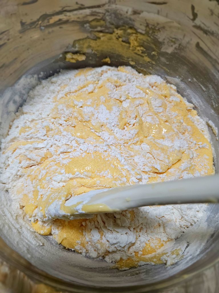 Gently folding the batter Gently mixing the batter