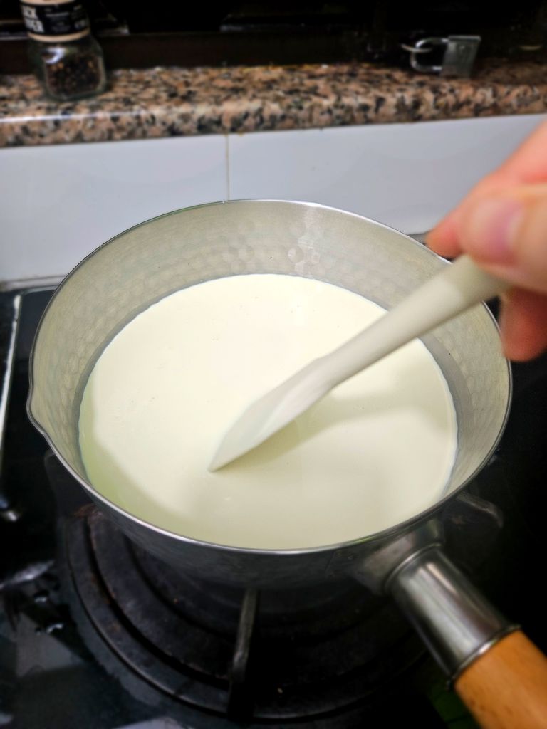 Heating milk and cream gently Heating dairy