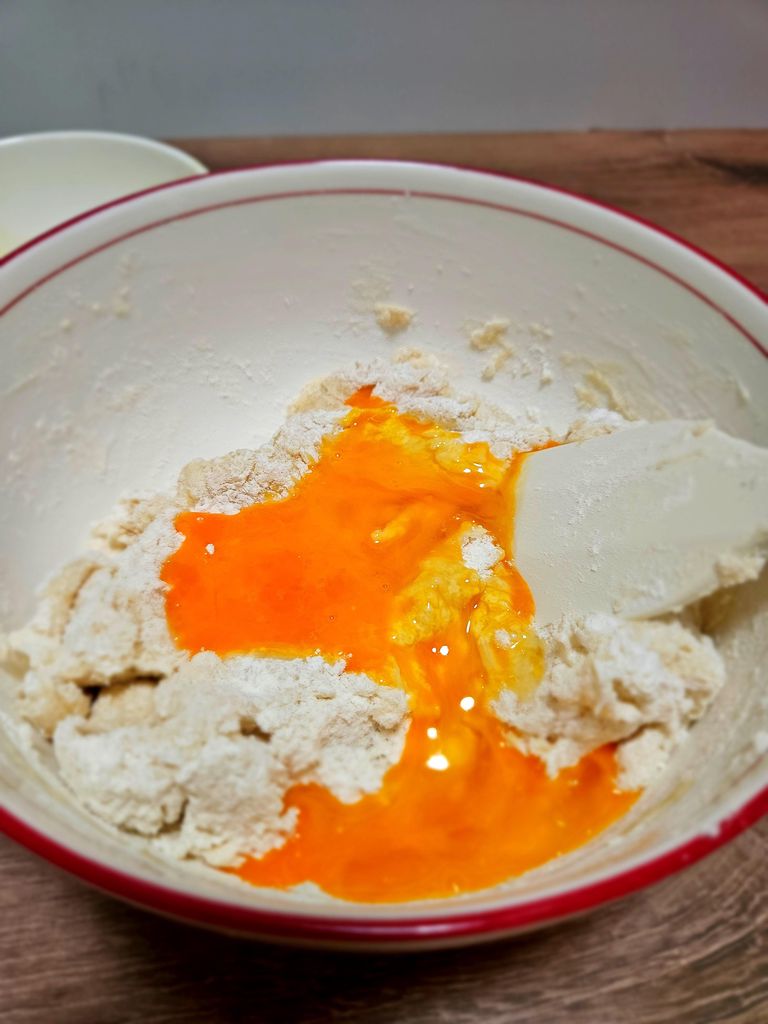 Adding the room-temperature egg last.