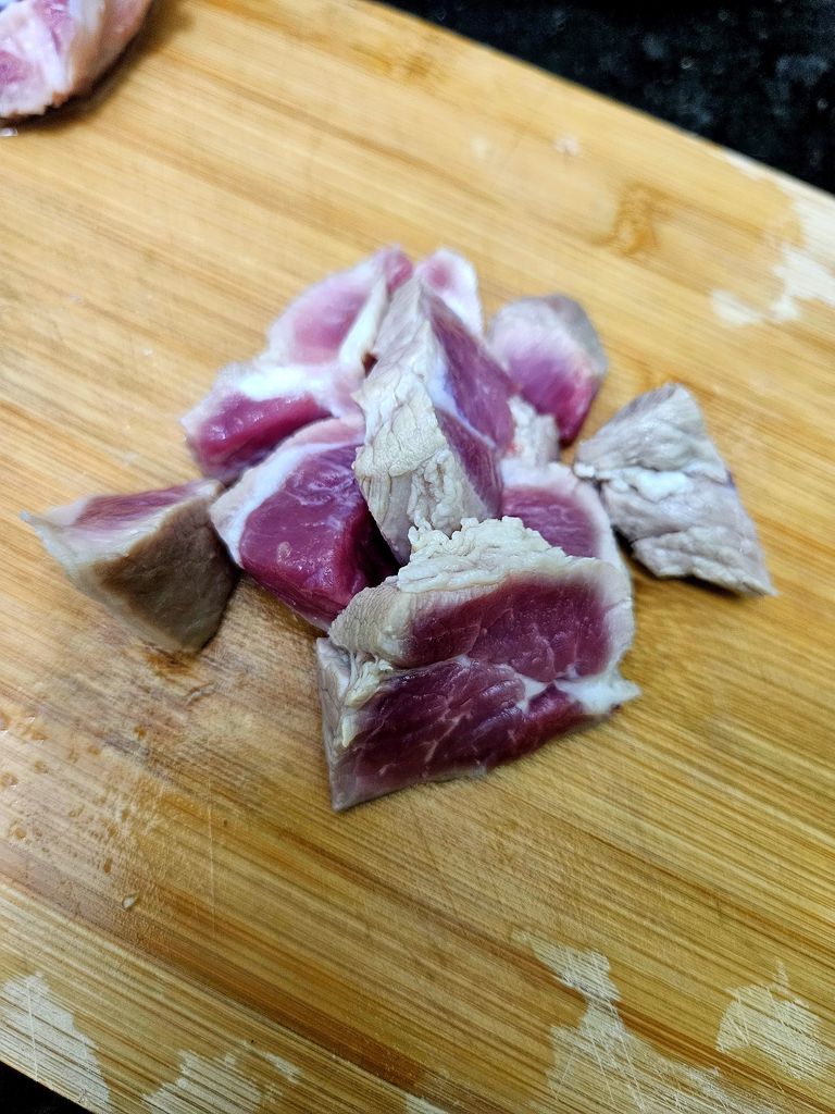 Slicing the pork into thin pieces